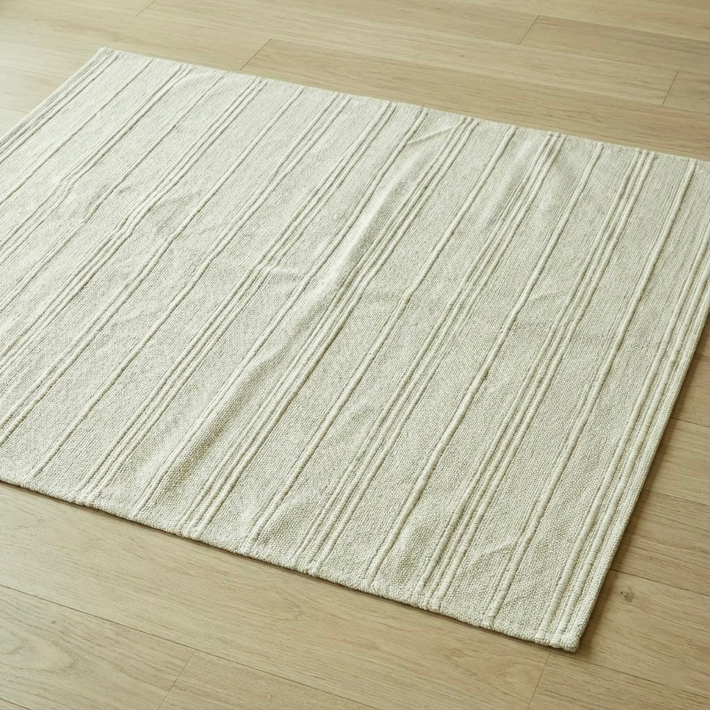 Alfombra Cotty beige “paper” — algodón tejido plano 120 × 170 cm